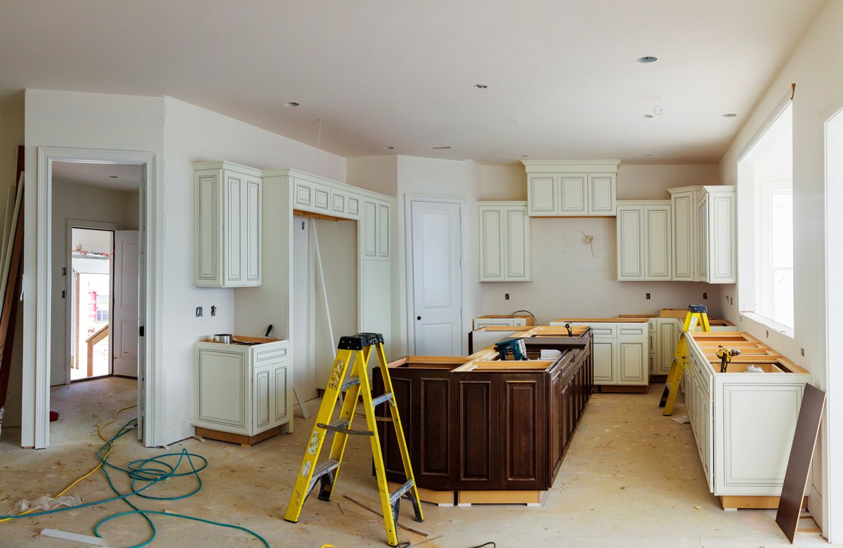 kitchen-contractors-el-paso A kitchen remodel in progress with a yellow ladder in El Paso.