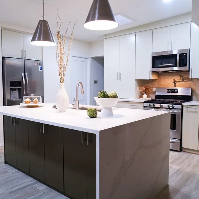 Modern kitchen remodel with white cabinets and quartz countertops in El Paso home